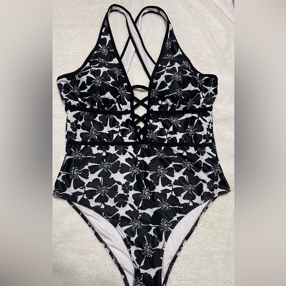 Black and White One Piece with Criss-Cross Straps and High-Cut Legs